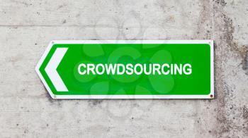 Green sign on a concrete wall - Crowdsourcing