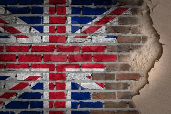 Dark brick wall texture with plaster - flag painted on wall - United Kingdom