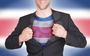 Businessman opening suit to reveal shirt with flag, Costa Rica