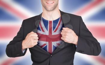 Businessman opening suit to reveal shirt with flag, United Kingdom