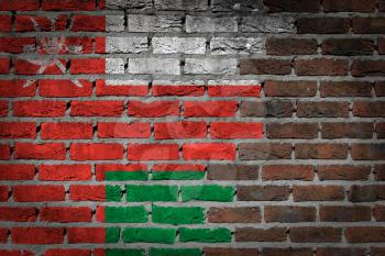 Very old dark red brick wall texture with flag - Oman