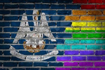 Dark brick wall texture - coutry flag and rainbow flag painted on wall - Louisiana