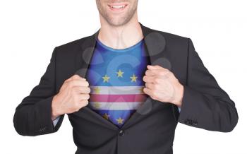 Businessman opening suit to reveal shirt with flag, Cape Verde