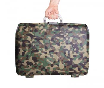 Used plastic suitcase with stains and scratches, printed with camouflage pattern