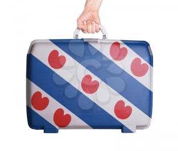 Used plastic suitcase with stains and scratches, printed with flag, Friesland