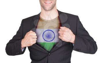 Businessman opening suit to reveal shirt with flag, India