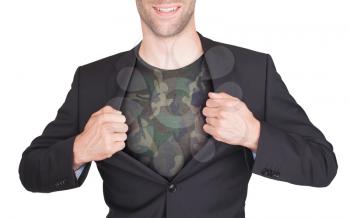 Businessman opening suit to reveal shirt, army camouflage