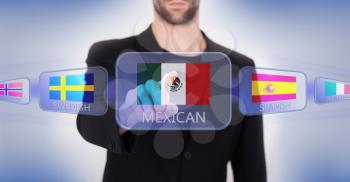 Hand pushing on a touch screen interface, choosing language or country, Mexico