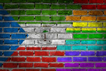 Dark brick wall texture - coutry flag and rainbow flag painted on wall - Equatorial Guinea