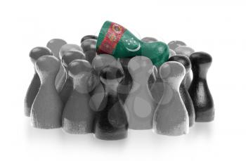 Blue pawn is crowdsurfing over a collection of different colors of pawns