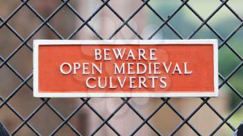 Red sign - Beware of open medieval culverts