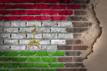 Dark brick wall texture with plaster - flag painted on wall - Tajikistan