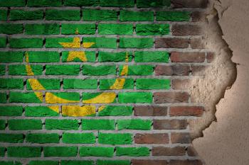 Dark brick wall texture with plaster - flag painted on wall - Mauritania