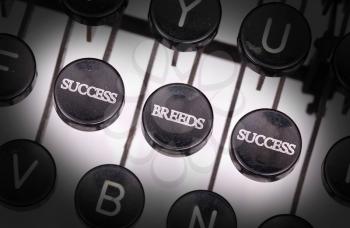 Typewriter with special buttons, success breeds success