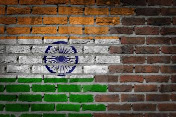 Very old dark red brick wall texture with flag - India