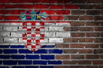 Very old dark red brick wall texture with flag - Croatia