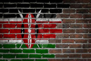 Very old dark red brick wall texture with flag - Kenya