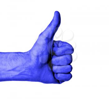 Closeup of male hand showing thumbs up sign against white background, blue skin