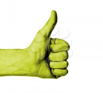 Closeup of male hand showing thumbs up sign against white background, yellow skin