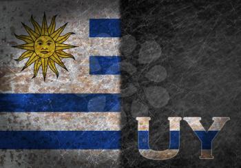 Old rusty metal sign with a flag and country abbreviation - Uruguay