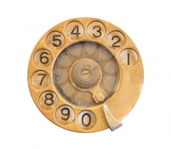 Close up of Vintage phone dial on white, gold