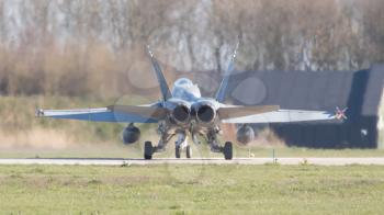 LEEUWARDEN, NETHERLANDS - APRIL 11, 2016: Finish Air Force F-18 Hornet landing during the exercise Frisian Flag. The exercise is considered one of the most important NATO training events this year.