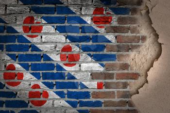 Dark brick wall texture with plaster - flag painted on wall - Friesland