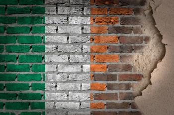 Dark brick wall texture with plaster - flag painted on wall - Ireland