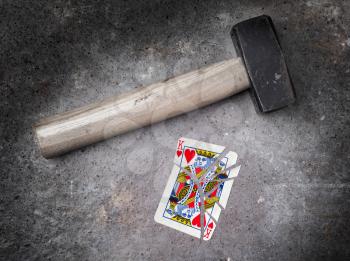 Hammer with a broken card, vintage look, king of hearts