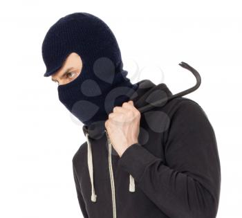 Thief burglar in balaclava mask with metal crowbar