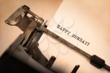 Vintage typewriter close-up - Happy Sunday, concept of motivation