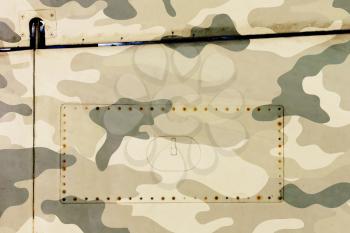 Piece of aircraft grunge metal background, army camo, old and worn