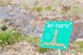 Sign, caution hot! - Erupting Geysir on Iceland