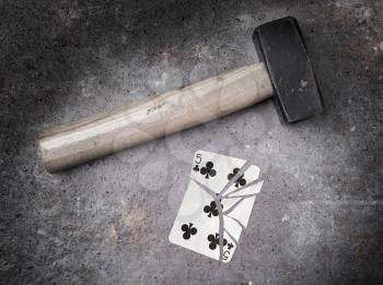 Hammer with a broken card, vintage look, five of clubs