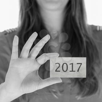 Woman showing a business card - New year - 2017