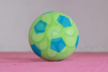 Shot of a green foam ball in a gym