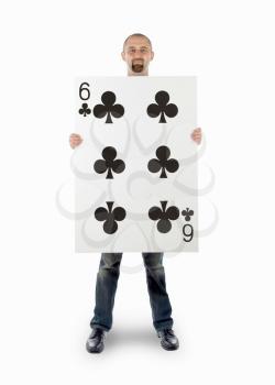 Businessman with large playing card - Six of clubs