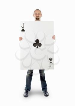 Businessman with large playing card - Jack of clubs