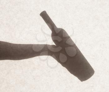 Silhouette behind a transparent paper - Bottle of wine