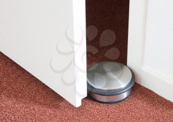 Dusty doorstop in a modern house, selective focus
