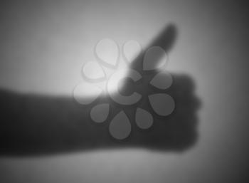 Silhouette behind a transparent paper - Blurred - Thumbs up
