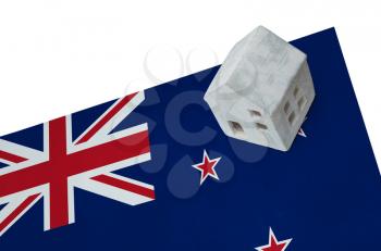 Small house on a flag - Living or migrating to New Zealand