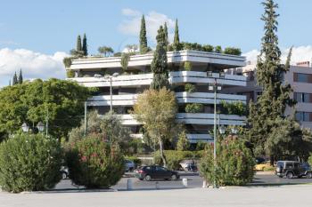 Block of flats in Athens - Covert in trees and plants
