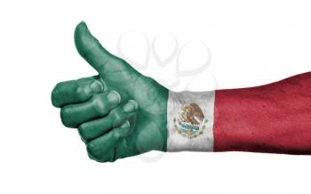 Old woman with arthritis giving the thumbs up sign, isolated on white - Mexico