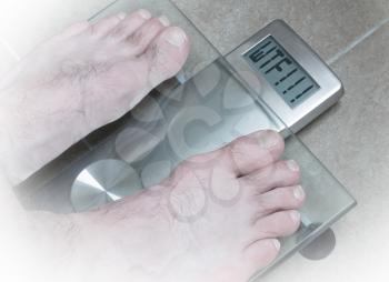Closeup of man's feet on weight scale - WTF!!!