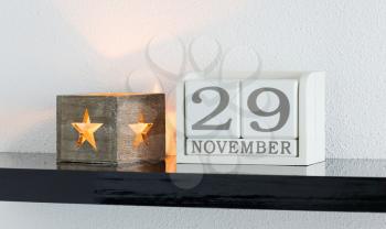 White block calendar present date 29 and month November on white wall background