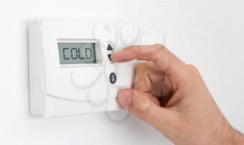 Vintage digital thermostat - Cold - Man adjusting the temperature