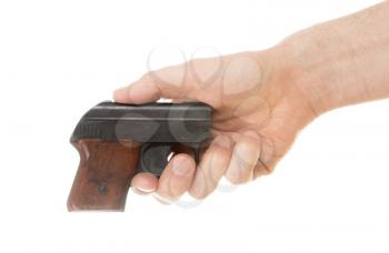 Small old alarm pistol in the hands of an adult man