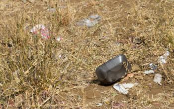 Pollution at the side of the road, plastics and paper in nature, Botswana