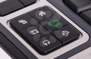 Buttons on a keyboard, selective focus on the middle right button - Power